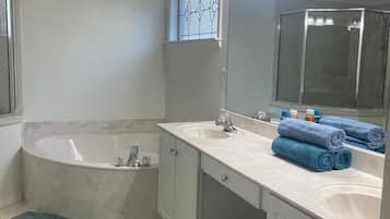 Jetted bath, hair dryer, towels, soap