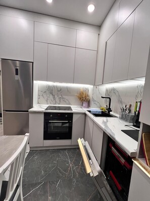 Private kitchen - Spacious 2-bedroom apartment with WiFi, AC in enjoyable Almaty (Almaty)