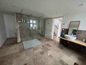 Shower, hair dryer, towels, soap