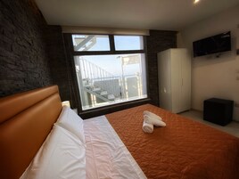 Comfort Double Room, Patio, Partial Ocean View | In-room safe, iron/ironing board, free WiFi