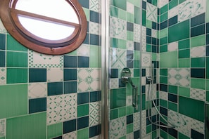 Deluxe Quadruple Room, Sea View | In-room safe, desk, laptop workspace, blackout drapes