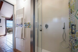 Deluxe Quadruple Room | In-room safe, desk, laptop workspace, blackout curtains