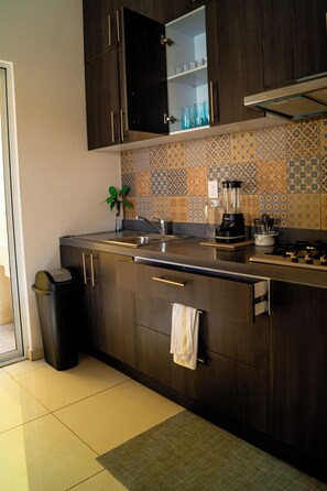 Fridge, microwave, stovetop, coffee/tea maker
