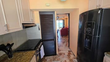 Apartamento família, vista para a praia | Cozinha privada