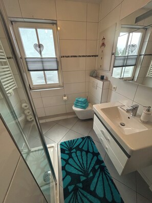 Shower, hair dryer, towels, soap