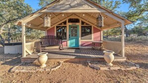 A small, single-story building with a pitched roof and a porch. - Tranquil Retreat W/hot-tub 10-mins to Downtown! (Fredericksburg)