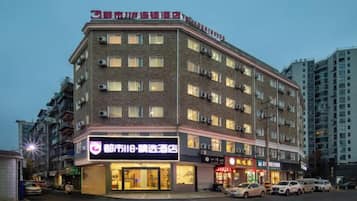 A multi-story hotel with a prominent entrance and signage.