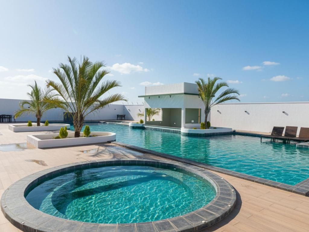 A swimming pool area with a circular hot tub, palm trees, and a modern building structure.