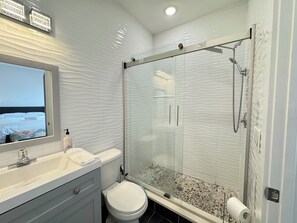 Shower, hair dryer, towels, soap