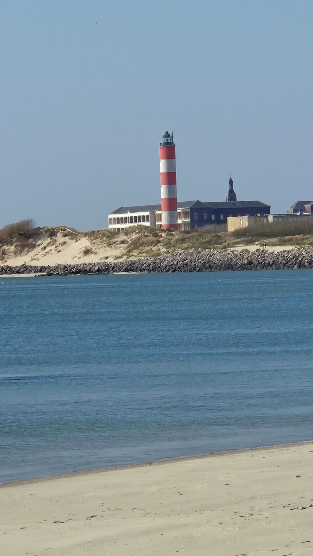 On the beach, sun-loungers