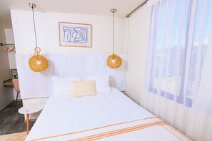 1 bedroom, desk, iron/ironing board, travel crib
