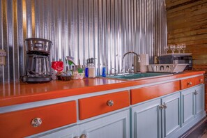 Fridge, microwave, coffee/tea maker, dining tables