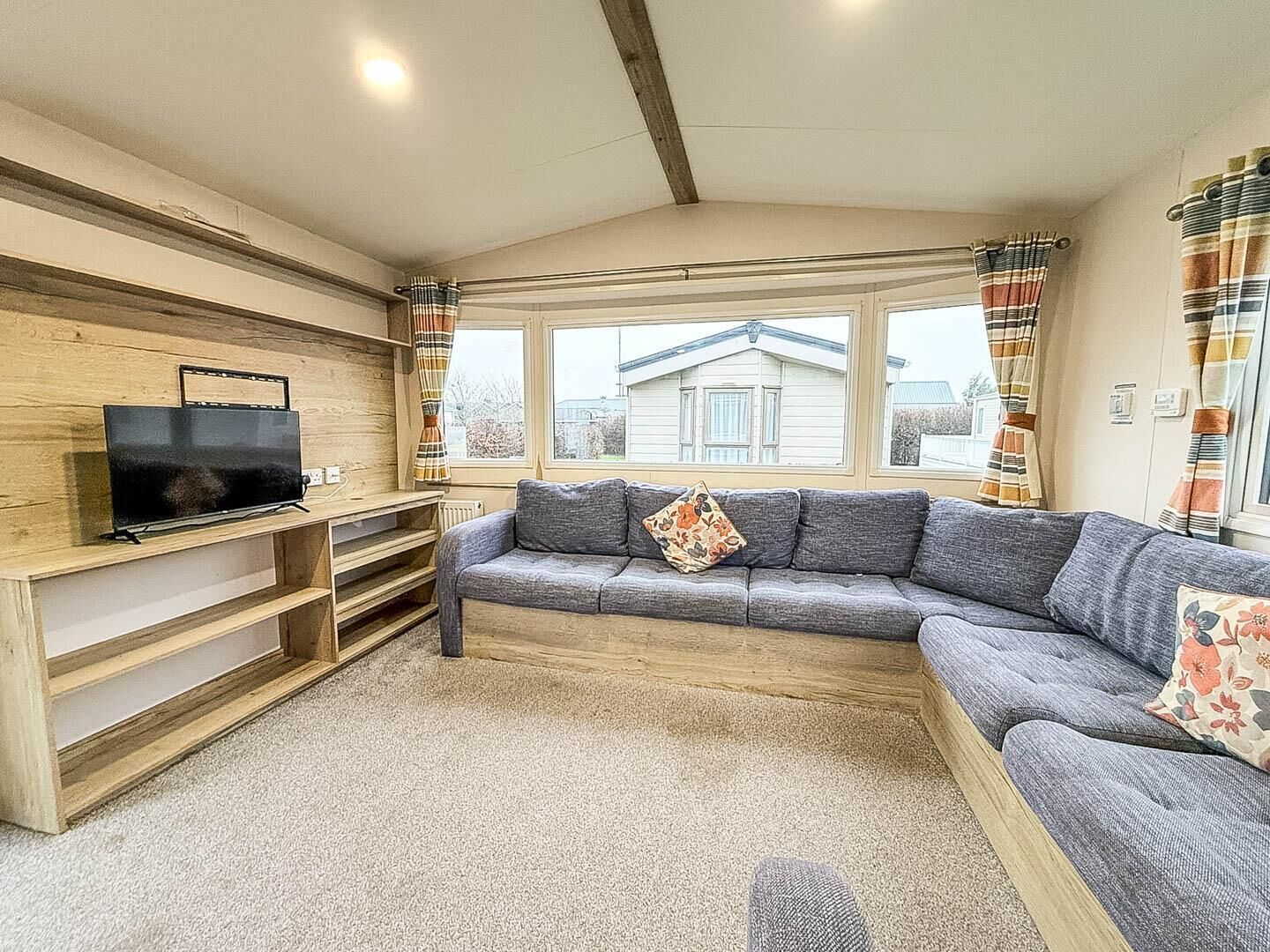 Plush seating and warm lighting combine to make a perfect space for unwinding after a busy day of activities.