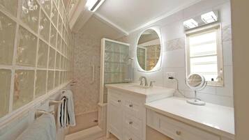 Shower, hair dryer, towels, soap