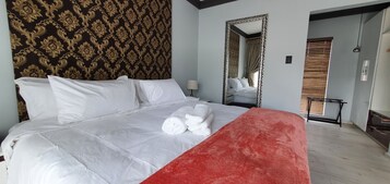 Deluxe Double Room, Courtyard View | In-room safe, desk, laptop workspace, iron/ironing board