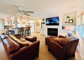 Smart TV, fireplace, books, printers