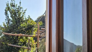 A wooden building with a window and a sign that reads "Val Trapa". - AGRITURISMO VALFRAJA (Cembra)