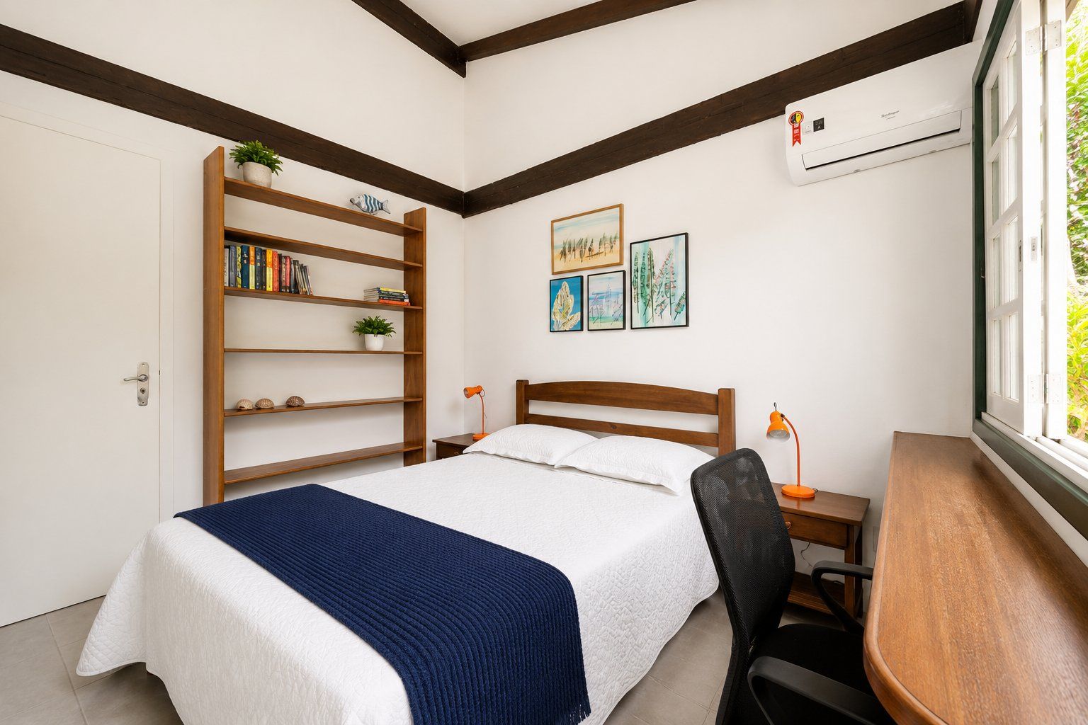 A bedroom with a bed, a desk, a chair, a bookshelf, and a window.