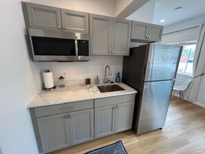 Fridge, microwave, coffee/tea maker, toaster