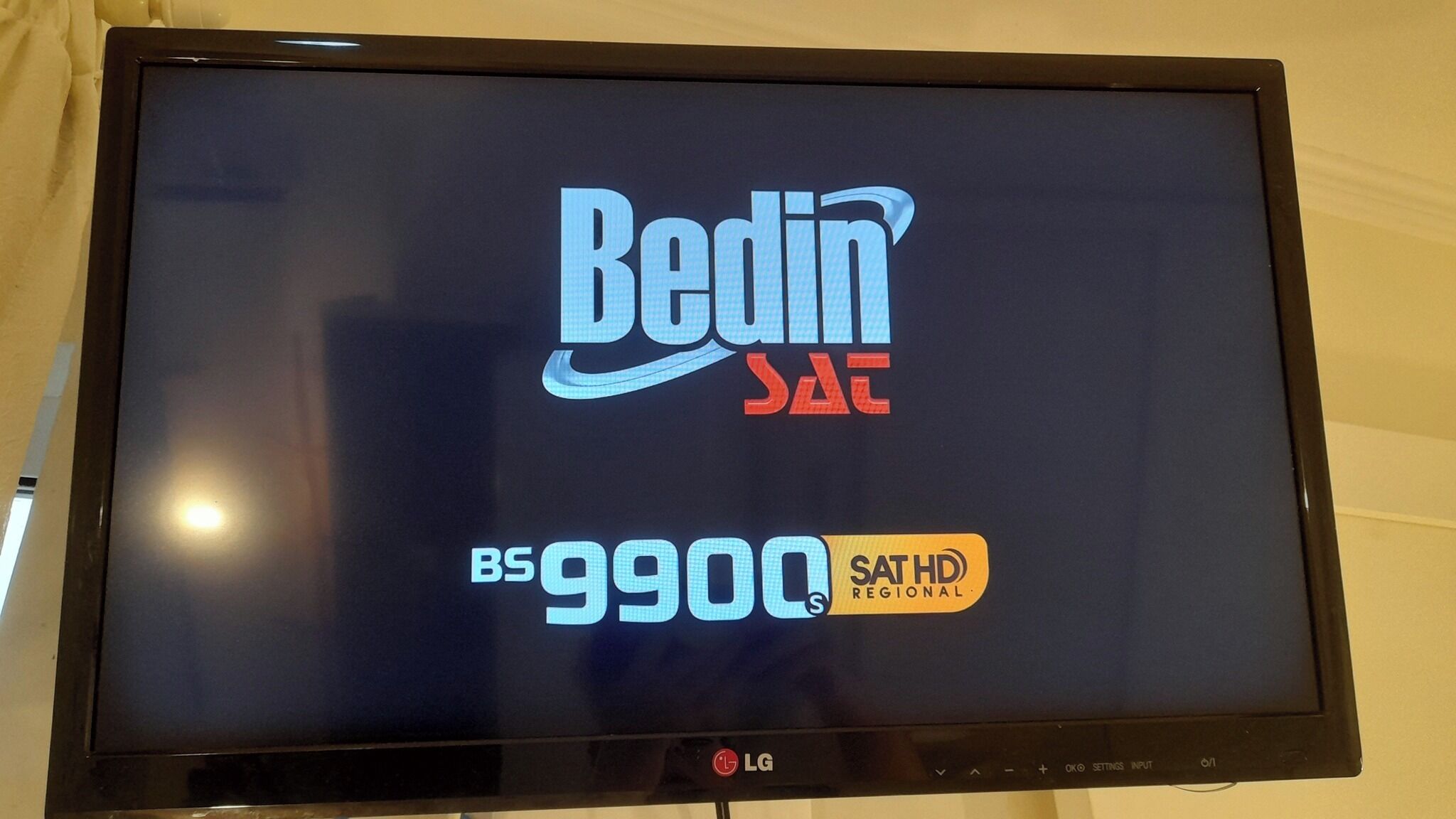 A television screen displaying the logo for 'Bedin' SADC, indicating it is a regional channel.