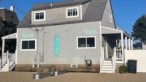 A two-story building with "North" and "South" signs on the side.