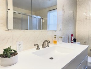 Shower, hair dryer, towels, soap