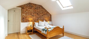 Historic cottage with a large scenic garden, located on a working farm