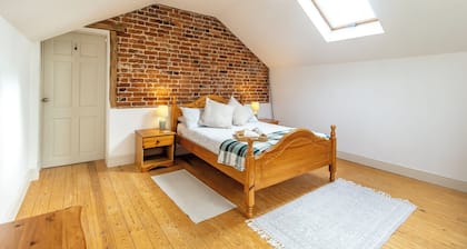 Historic cottage with a large scenic garden, located on a working farm