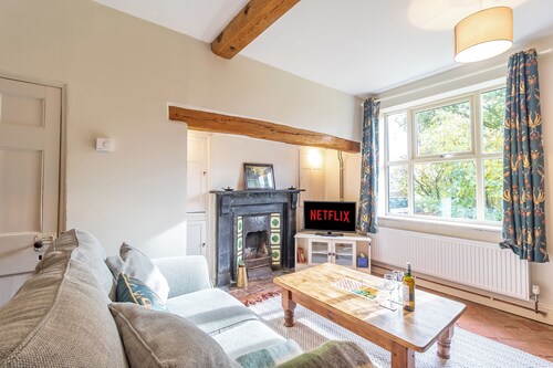 Historic cottage with a large scenic garden, located on a working farm