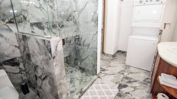 Shower, hair dryer, towels, soap