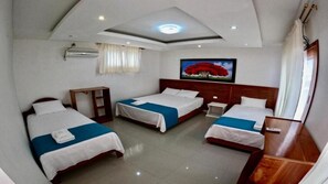 Deluxe Triple Room, Multiple Beds, Patio, Pool View | Desk, free WiFi, bed sheets - Galápagos Isabela Hotel Loja (Puerto Villamil)