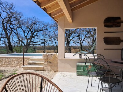 Large stone gîte for 12 people, swimming pool and boules pitch.