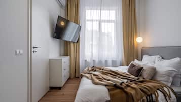 Apartamento Confort, 2 habitaciones | 2 dormitorios, cortinas opacas, tabla de planchar con plancha