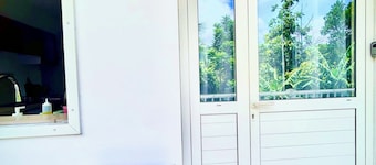 2-Bedroom Apartment - Les Jardins de Delgrès: Set in lush greenery, with views of the sea and mountains