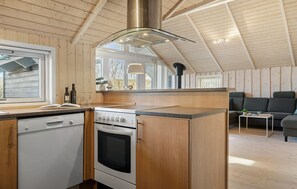 Fridge, stovetop, dishwasher, coffee/tea maker