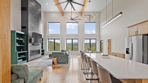 A spacious kitchen with a large island, built-in appliances, and a view of the outdoors. - 5 mins to Deadwood|Hot Tub|Game Room (Sturgis)