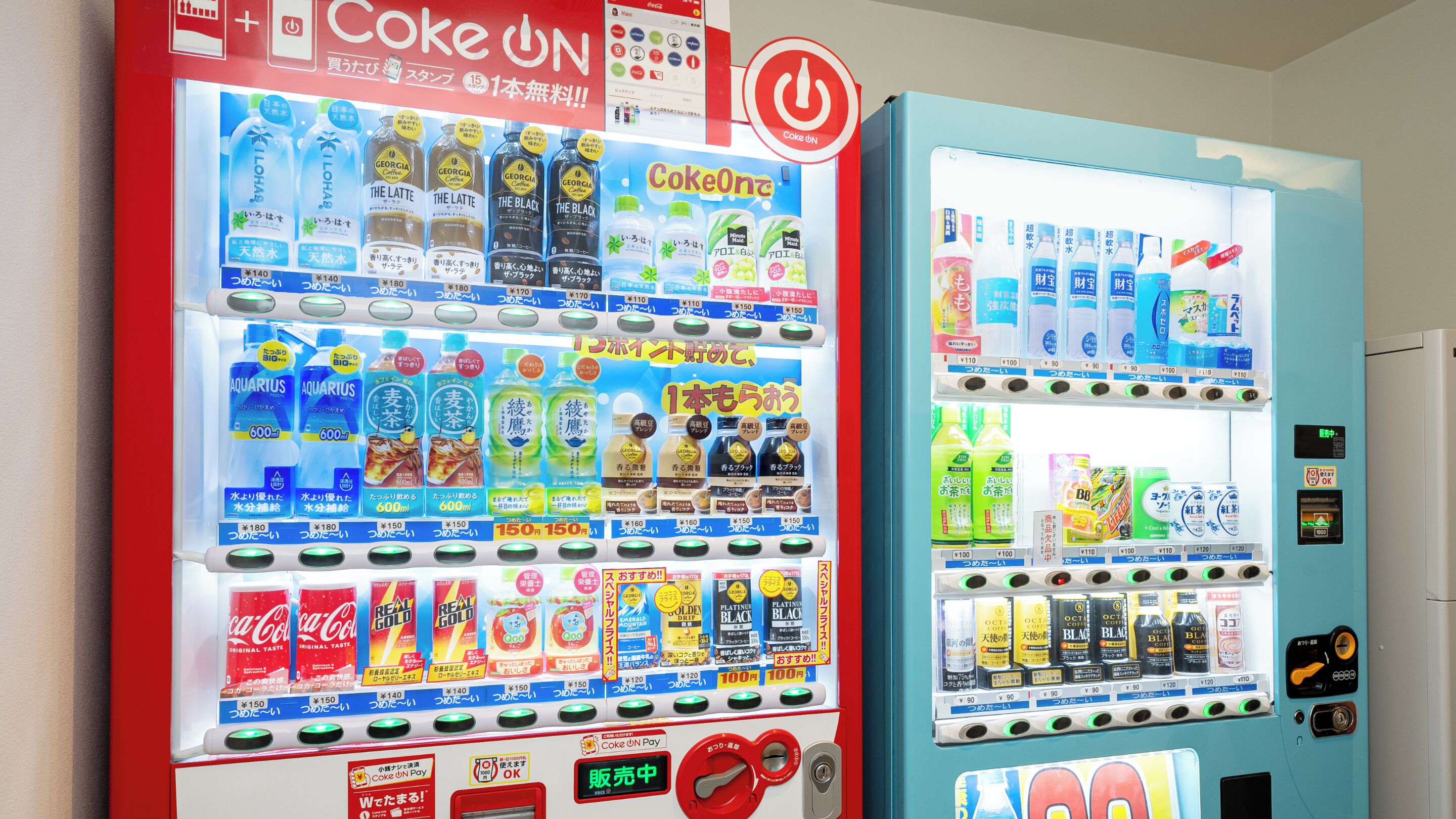 A vending machine with various beverages and snacks, including Coca-Cola and real gold tea.