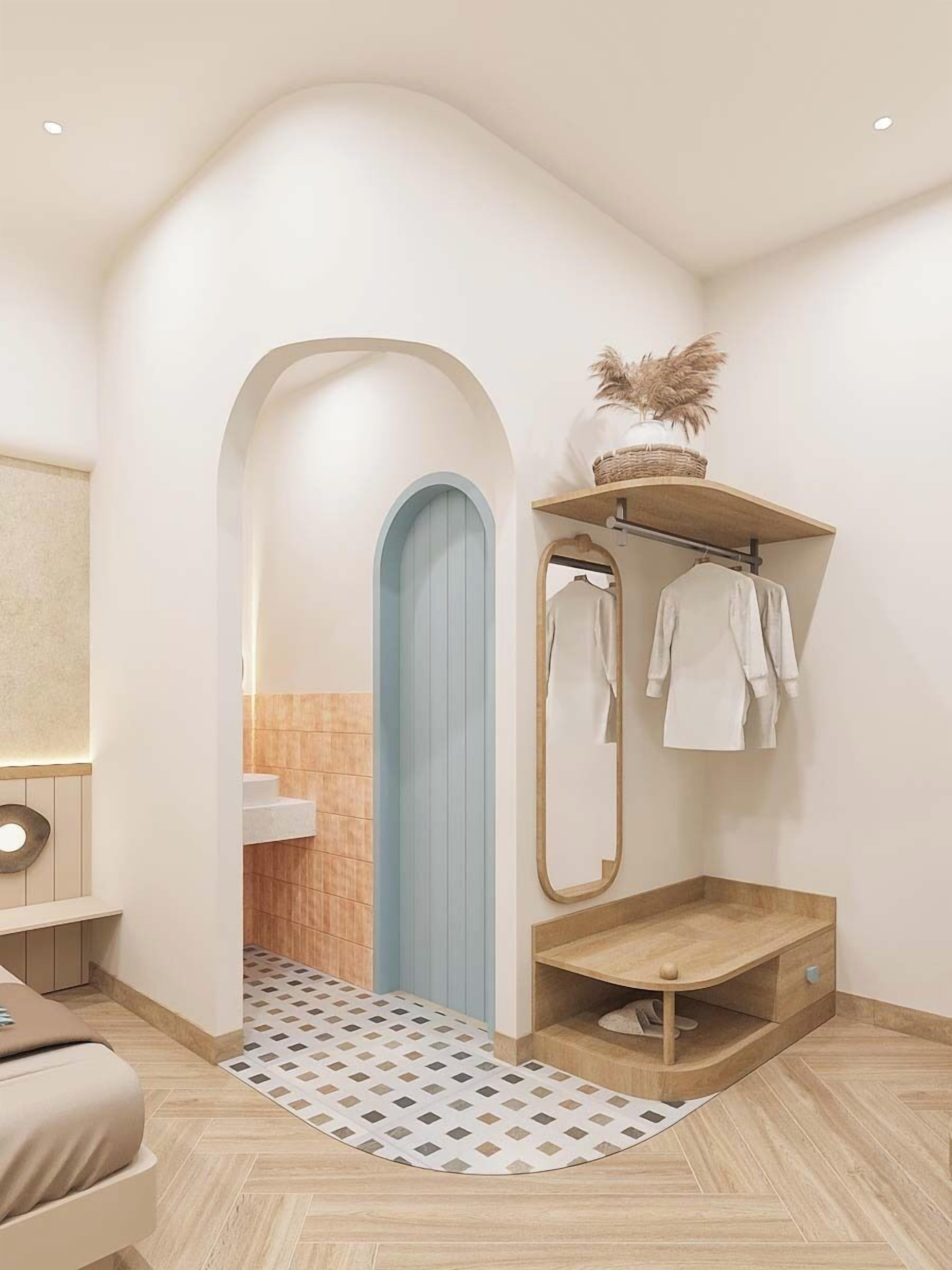A modern bathroom with a shower, a towel rack, and a wooden shelf with decorative items.
