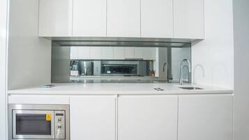 Fridge, microwave, oven, cookware/dishes/utensils