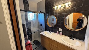 Shower, hair dryer, towels, toilet paper