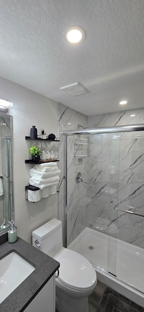 Hair dryer, towels, soap, shampoo. Legal One Bedroom Basement Suite with a Seperate Entrance and Full Kitchen
