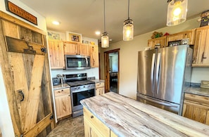 Dishwasher, cookware/dishes/utensils, dining tables, kitchen islands