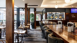 A restaurant with a bar area, seating, and a sports bar section. - The Lakes Hotel, Rosebery (Rosebery)