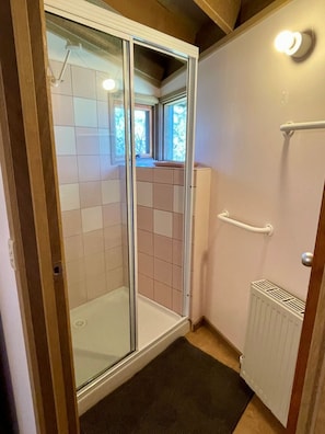 Shower, hair dryer, towels, soap