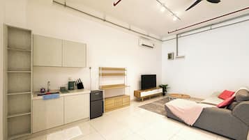 Estudi en suite Deluxe, vistes a la ciutat | Sala d'estar