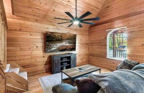 Signature Cabin, 2 Bedrooms, Hot Tub, Mountain View | Living room | 75-inch Smart TV with digital channels, fireplace - Lovely Cabin near GSMNP & Attractions (Gatlinburg)