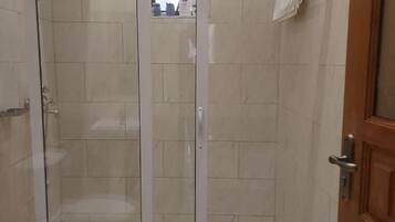 Shower, towels, soap, toilet paper