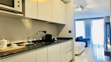 Fridge, microwave, stovetop, coffee/tea maker