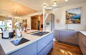 Fridge, stovetop, dishwasher, coffee/tea maker
