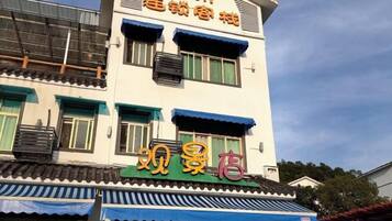 A building with a sign that reads 'View Store' and another sign above it that says '9th Floor.'